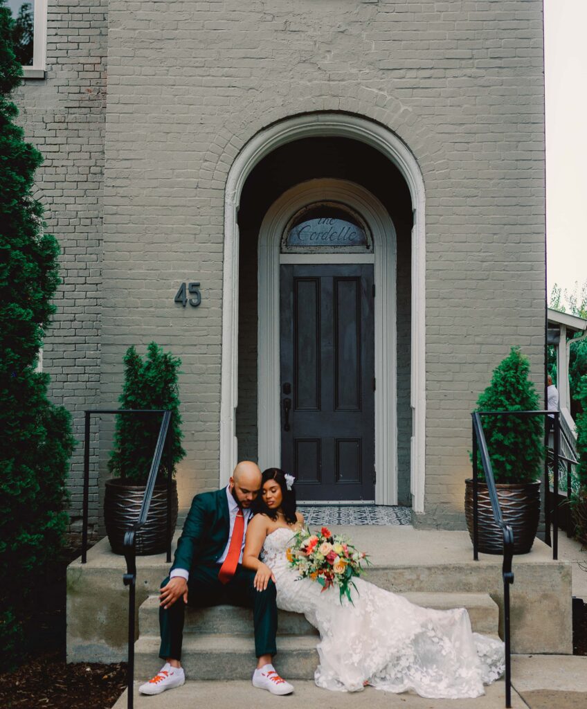 A newly married couple poses for a photo outside The Cordelle in Nashville, Tennessee. 