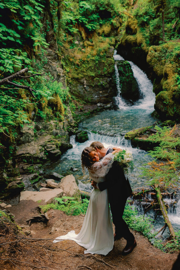 Romantic couple enjoying a scenic Alaskan forest adventure surrounded by nature's beauty.
